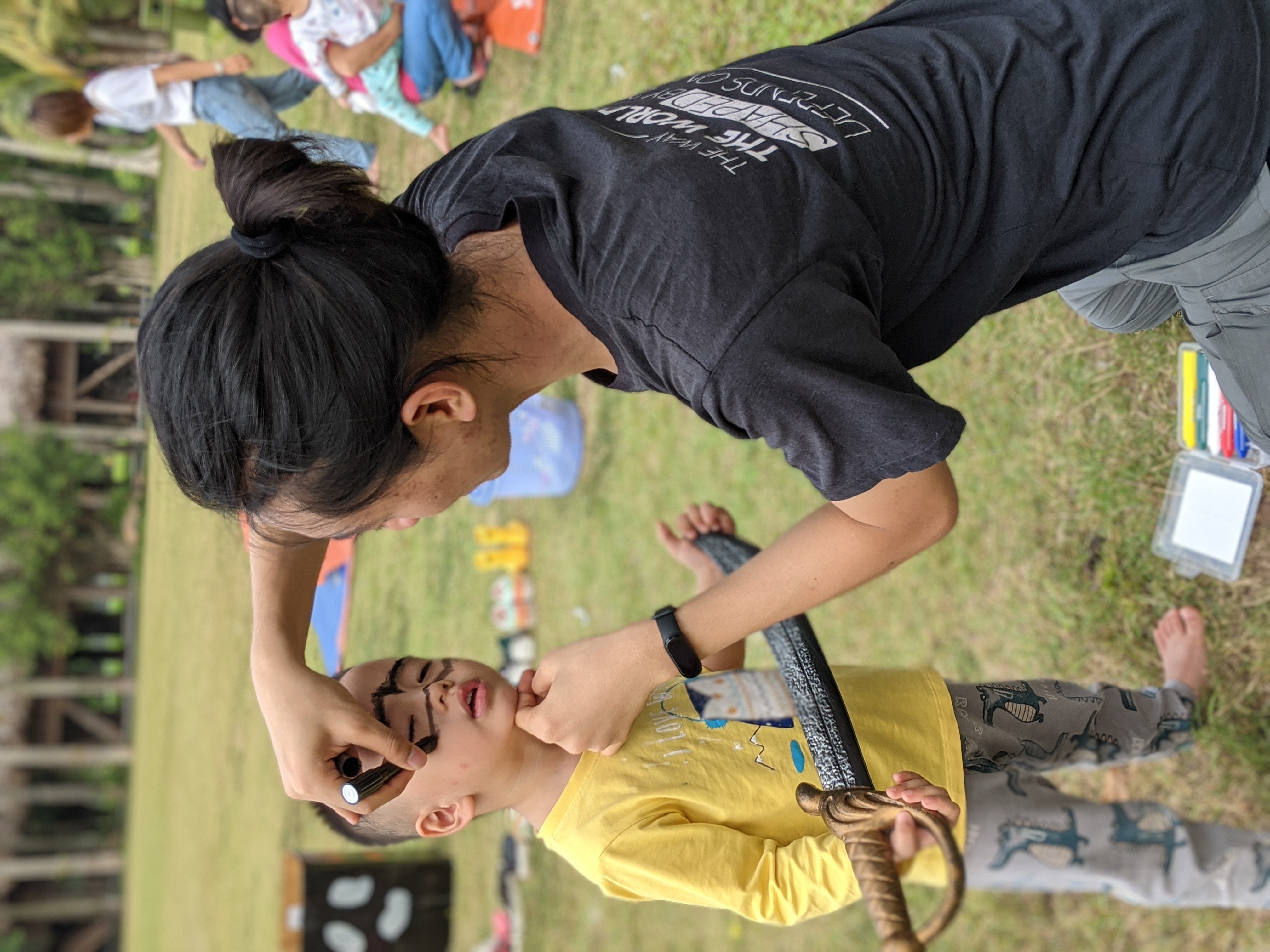 Face painting for Halloween at Swan Lake in Ecopark.